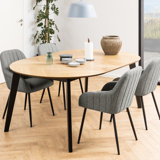 Extendable round table, featuring an oak effect top with a classic herringbone pattern.