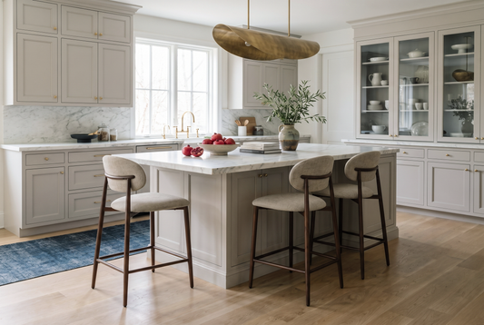 Modern kitchen with counter stools and bar stools illustrating the difference between kitchen island and breakfast bar seating heights
