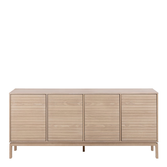 Modern light wood sideboard with four slatted doors and raised legs in Scandinavian design.
