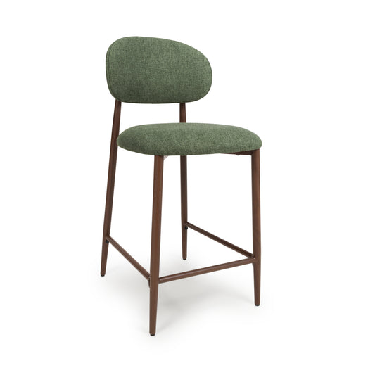 A modern Counter Chair with a textured sage green upholstered seat and curved backrest, supported by four tapered dark brown metal legs with a footrest.