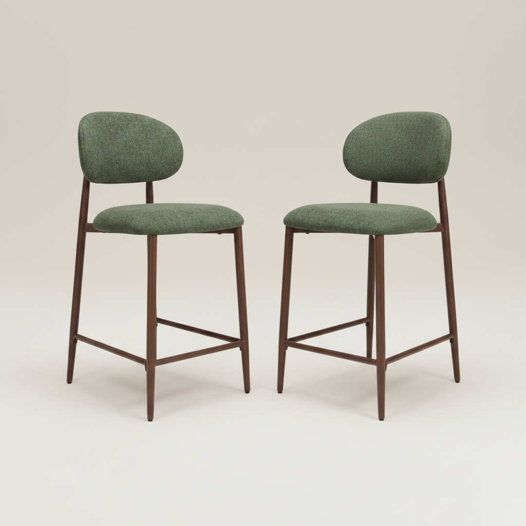 Two modern couter chairs with green upholstered seats and backs and dark brown wooden legs, shown on a light beige studio background.