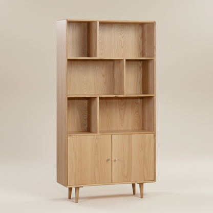 Wooden bookshelf with open shelves and closed doors