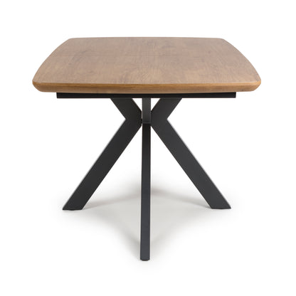 Kaelon dining table in rustic oak with black base