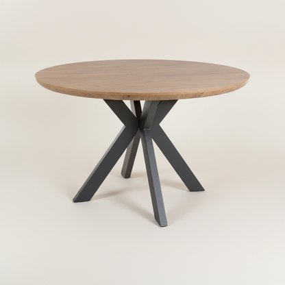 Round wooden table with black metal legs 